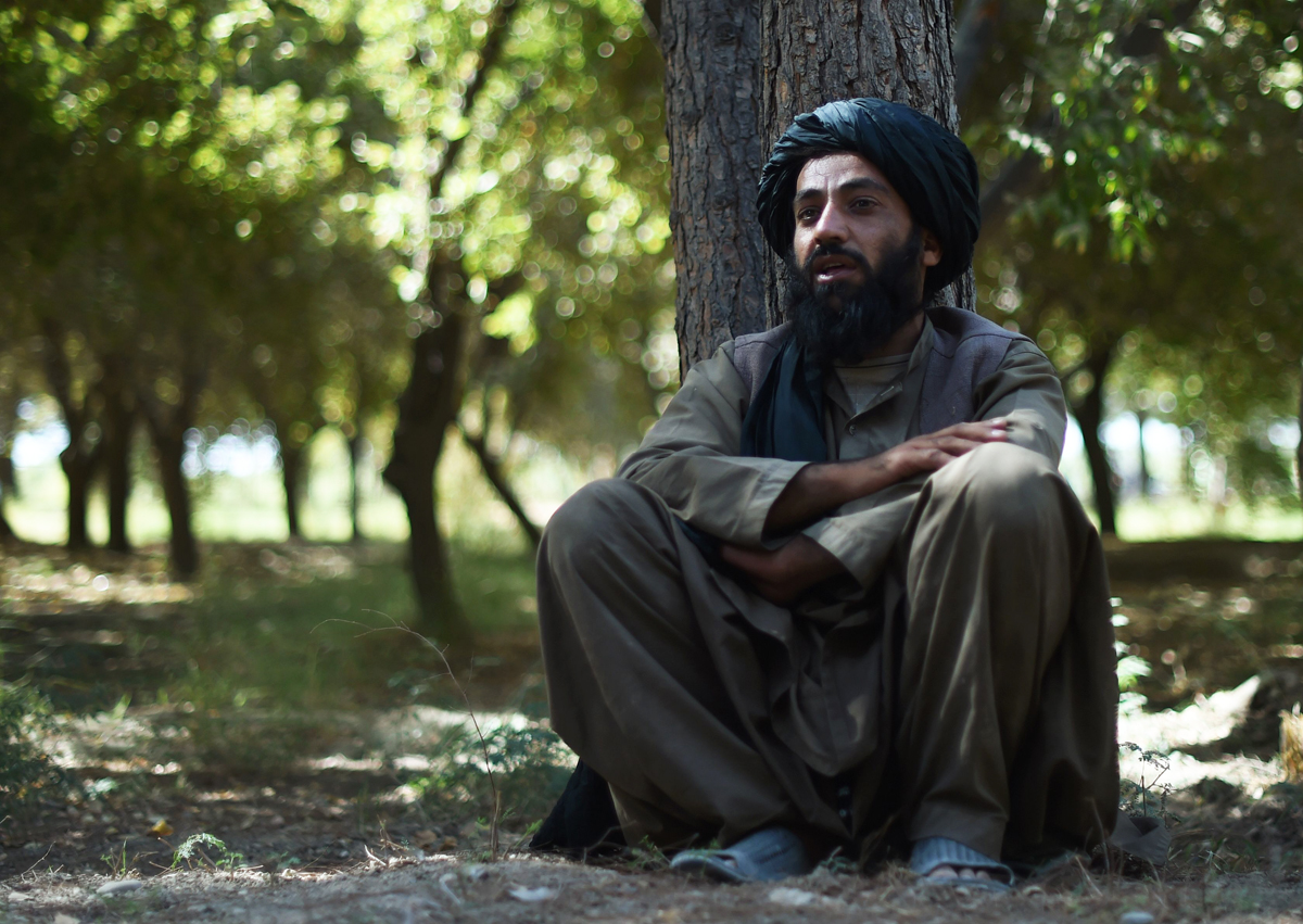 in this photograph taken on october 4 2016 poppy farmer nehmatullah 34 speaks during an interview in lashkar gah helmand province photo afp