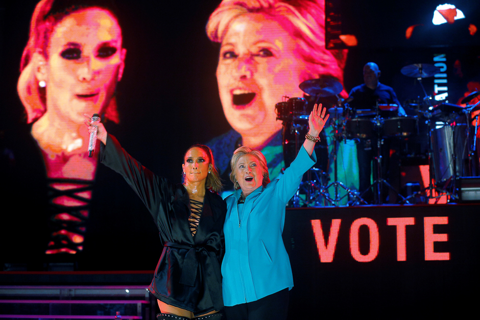 US Democratic presidential nominee Hillary Clinton joins performer Jennifer Lopez at a campaign concert in Miami, Florida, US. PHOTO: REUTERS