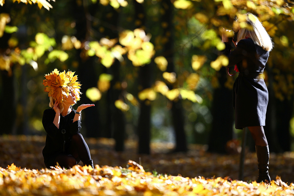 Women enjoy a sunny autumn day in Central Park in Minsk, Belarus, on October 13. PHOTO: REUTERS