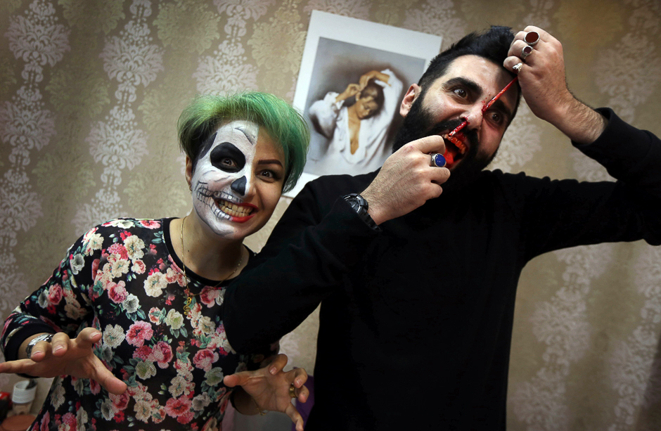 Iraqi Kurds pose with their make up as they prepare for Halloween in Arbil, the capital of the autonomous Kurdish region of northern Iraq. PHOTO: AFP