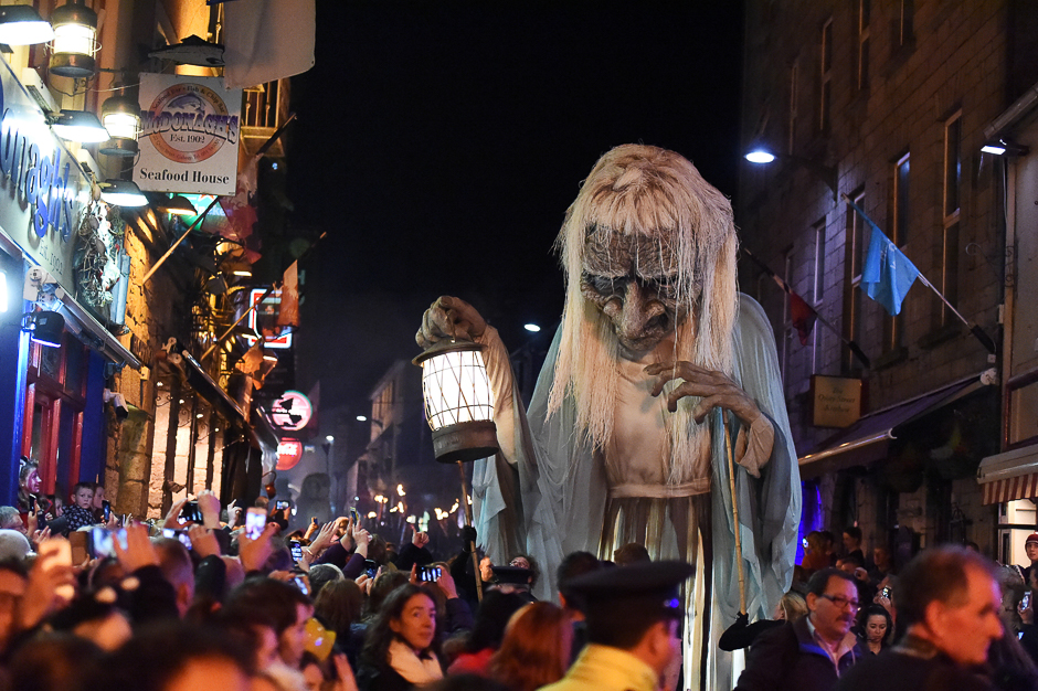 A member of street performance troupe Macnas participates in their 30th anniversary during the Halloween parade called Savage Grace in Galway, Ireland. PHOTO: AFP