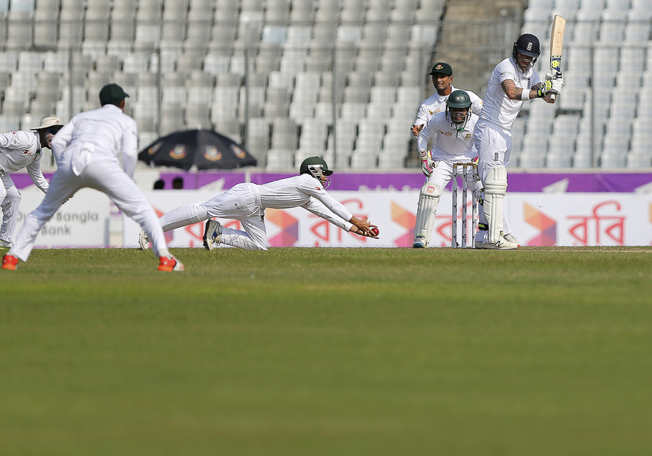Bangladesh's Mominul Haque dives to take a catch to dismiss England's Ben Stokes. PHOTO: REUTERS