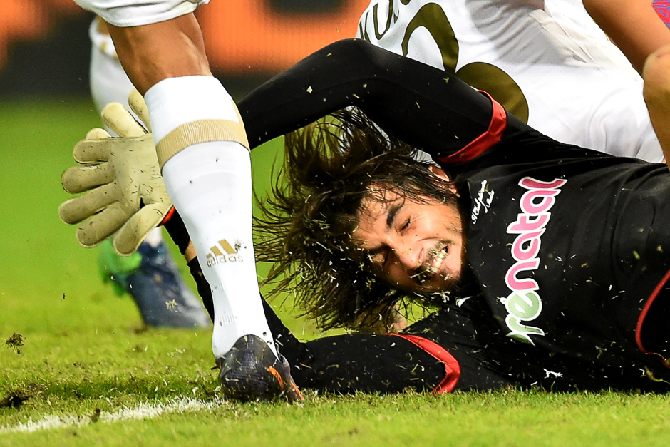 Genoa's goalkeeper from Italy Mattia Perin fights for the ball with AC Milan's forward from Colombia Carlos Bacca during the Italian Serie A football match Genoa vs AC Milan at 