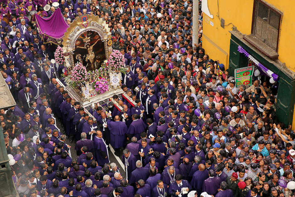 Believers attend the procession of Senor de Los Milagros ( 'Lord of Miracles' ), Peru's most revered Catholic religious icon, in downtown Lima, Peru. PHOTO: REUTERS