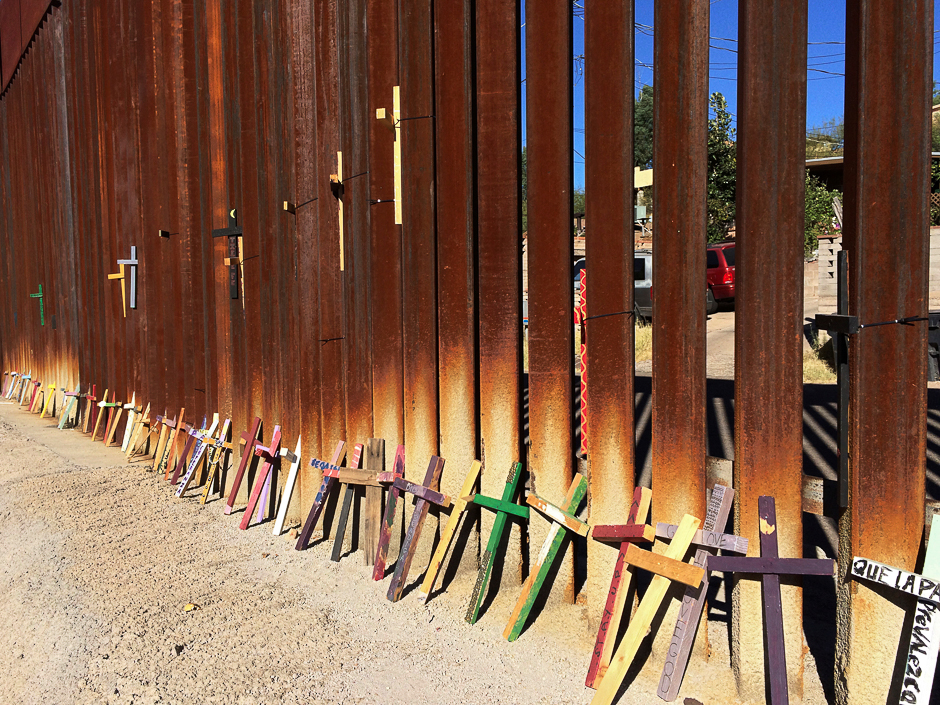 Wooden crosses, in memory of migrants who died crossing to the US, lean on the border fence between Mexico and the US in Nogales, in Sonora state, Mexico. PHOTO: REUTERS