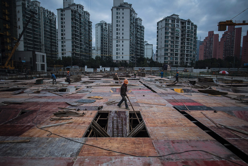 A man works at a construction site of a residential skyscraper in Shanghai. PHOTO: AFP