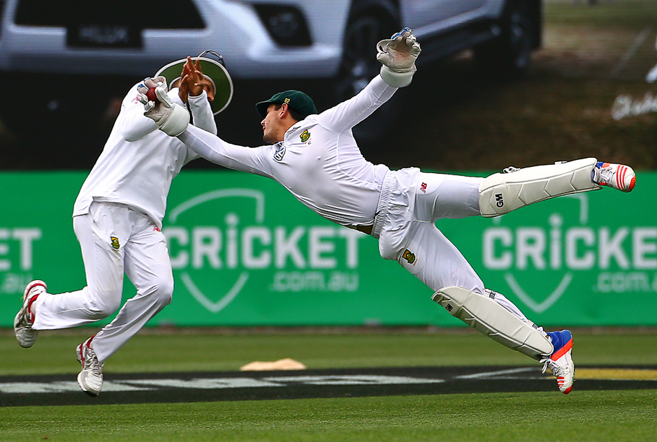 South Africa's wicketkeeper Quinton de Kock dives to take a catch to dismiss Australia's Nathan Lyon. PHOTO: REUTERS