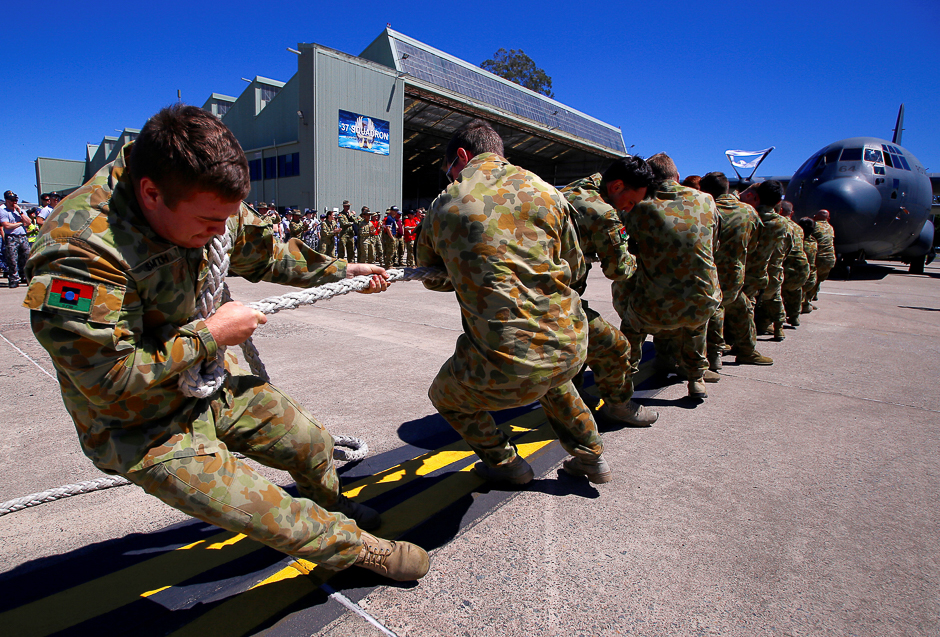 Members of the Australian Army participate in the Tri-service Herculean Challenge, which involves teams of Australian Defence Force personnel pulling a C-130J Hercules aircraft weighing over 40 tonnes over a distance of ten metres in the fastest time, at the Royal Australian Air Force (RAAF) Base in Richmond, located west of Sydney, Australia. PHOTO: REUTERS