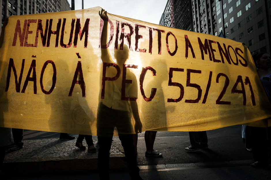 Protesters hold a banner against the constitutional amendment (PEC) 55, previously called 241, which limits budget increases to the rate of inflation for the next 20 years, during the nation-wide demonstration againt Temer's government in Rio de Janeiro, Brazil. PHOTO: AFP