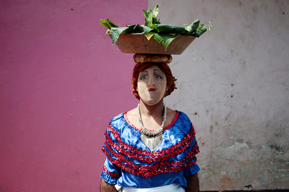 A man with a mask poses for a portrait as he takes part in festivities in honour of patron saint San Jeronimo in Masaya city, Nicaragua. PHOTO: REUTERS