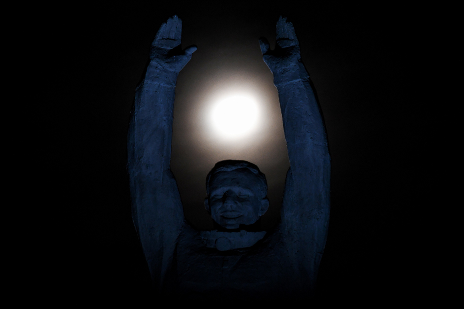 The moon is pictured over a statue of the first Russian cosmonaut Yuri Gagarin at the Russian leased Baikonur cosmodrome. PHOTO: AFP