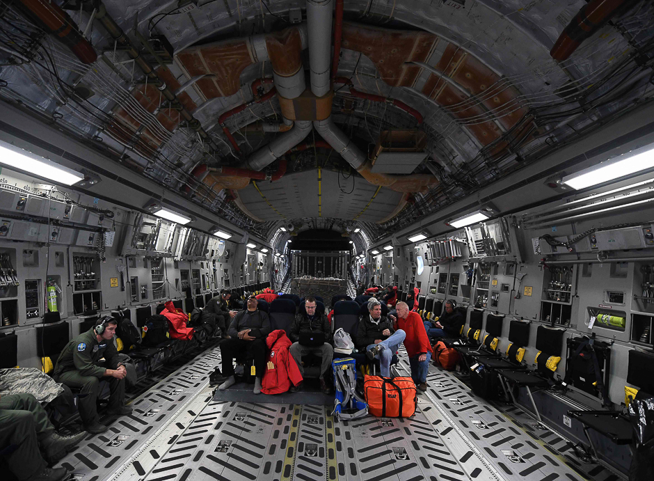 US Secretary of State John Kerry (R) sits onboard a US Air Force C-17 Globemaster as it leaves the McMurdo station in Antarctica for New Zealand. PHOTO: AFP