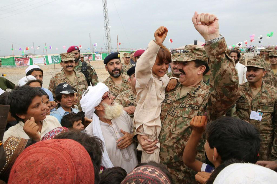 General Raheel Sharif, COAS on the Eid day visited IDP camp at Bannu and spent his time with children and IDPs and also presented them gifts. PHOTO: ISPR
