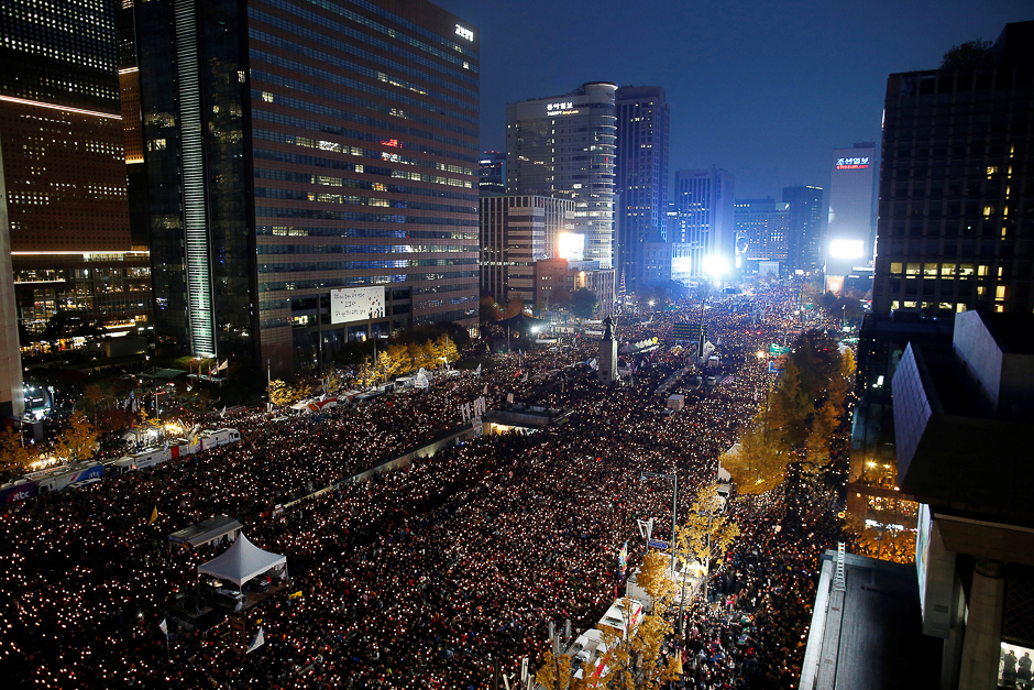 People take part in a rally calling for President Park Geun-hye to step down in central Seoul, South Korea. PHOTO: REUTERS