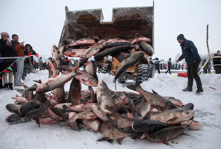 People participate in a winter fishing event in Changchun, Jilin province, China. PHOTO: REUTERS