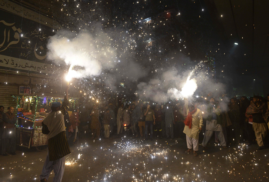 Muslims light fireworks in Lahore. PHOTO: AFP