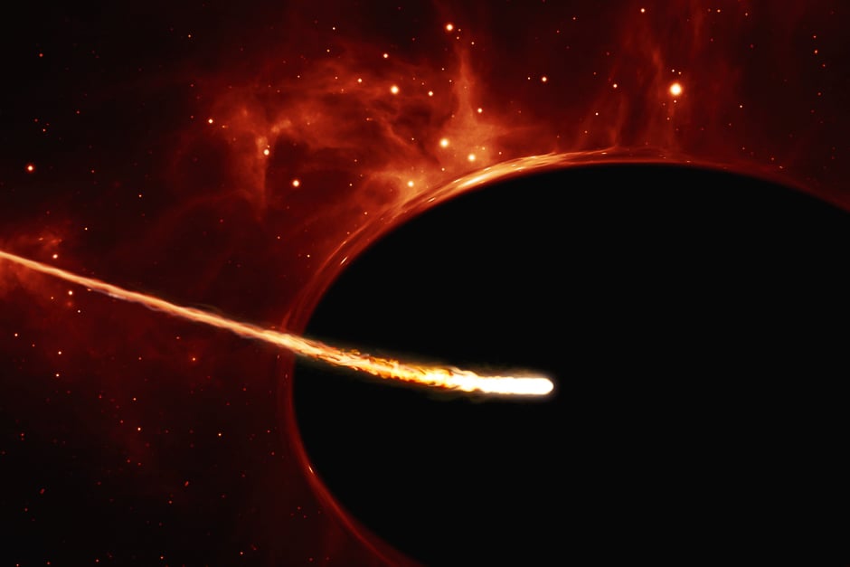 A handout artist's impression released on December 9, 2016 by the European Space Agency shows a Sun-like star close to a rapidly spinning supermassive black hole, with a mass of about 100 million times the mass of the Sun, in the centre of a distant galaxy. PHOTO: AFP