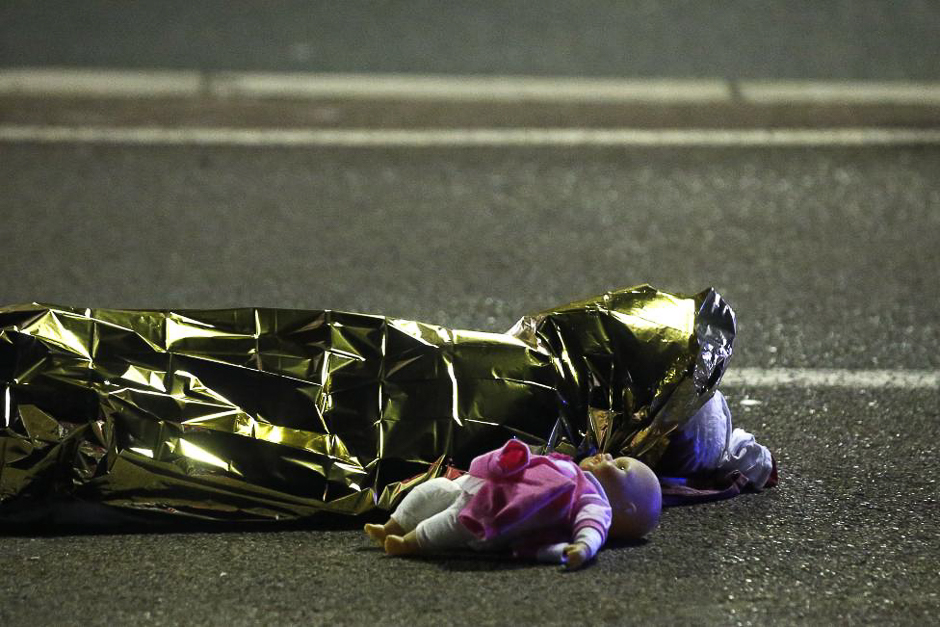 A body is seen on the ground July 15, 2016 after 86 people were killed in Nice, France, when a truck ran into a crowd celebrating the Bastille Day national holiday. PHOTO: REUTERS