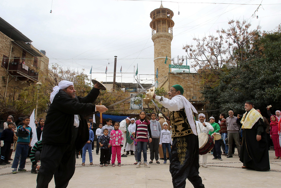 Lebanese Muslim men perform with sabres during a ritual ceremony in the southern city of Sidon. PHOTO: AFP