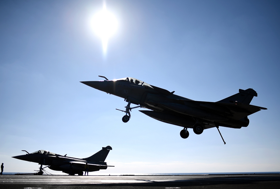 A French Rafale fighter jet lands on the deck of France's aircraft carrier Charles-de-Gaulle operating in the eastern Mediterranean Sea. PHOTO: AFP