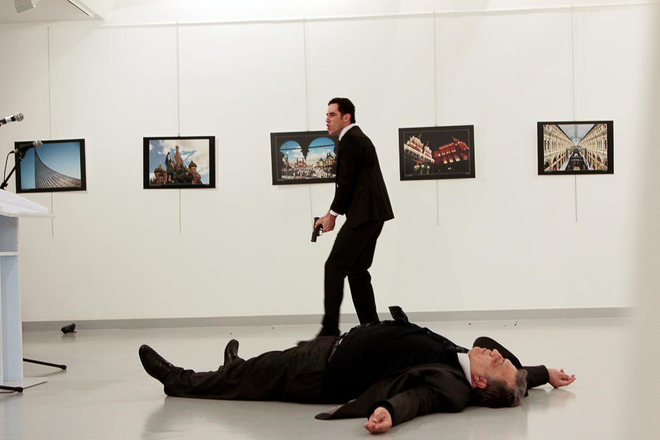 Russian Ambassador to Turkey Andrei Karlov lies on the ground after he was shot by Mevlut Mert Altintas at an art gallery in Ankara, Turkey. PHOTO: REUTERS