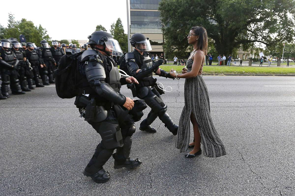 Demonstrator Ieshia Evans is detained by law enforcement as she protests the shooting death of Alton Sterling near the headquarters of the Baton Rouge Police Department in Baton Rouge, La., on July 9, 2016. PHOTO: REUTERS
