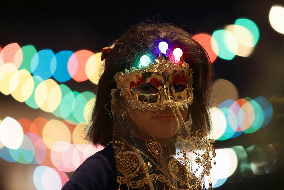 A girl wearing a mask takes part in a procession celebrating the religious holiday, Benghazi, Libya. PHOTO: REUTERS
