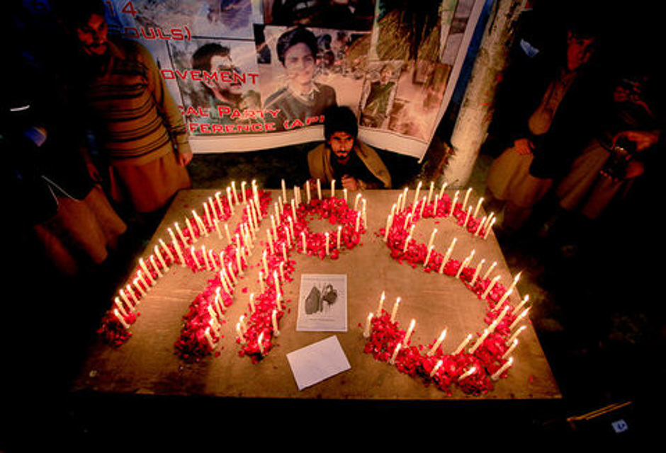 A man attends a candlelight vigil with others in commemoration of the victims of an attack on the Army Public School in 2014, in Islamabad, Pakistan, December 16, 2016. PHOTO: REUTERS