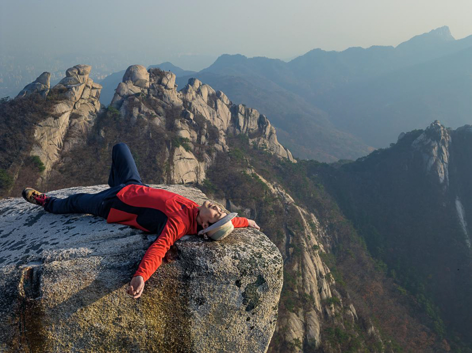 Within sight of downtown Seoul, South Koreaâs capital and a hub of modern stressful life, salesman Sungvin Hong rests after a hike in Bukhansan National Park. PHOTO: LUCAS FOGLIA/NATIONAL GEOGRAPHIC