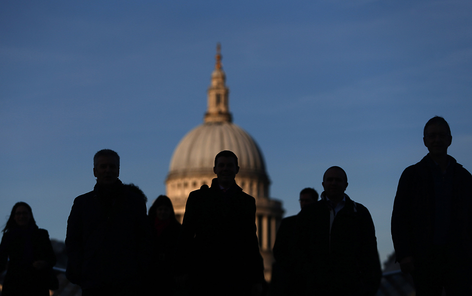 People walk across Millennium Bridge on the second day of a train strike in London, Britain. PHOTO: REUTERS