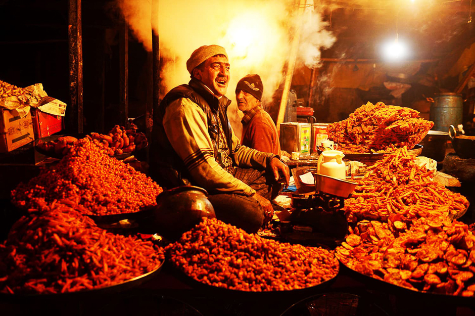 A Kashmiri vendor sells traditional Kashmiri snacks to be sold among devotees. PHOTO: AFP