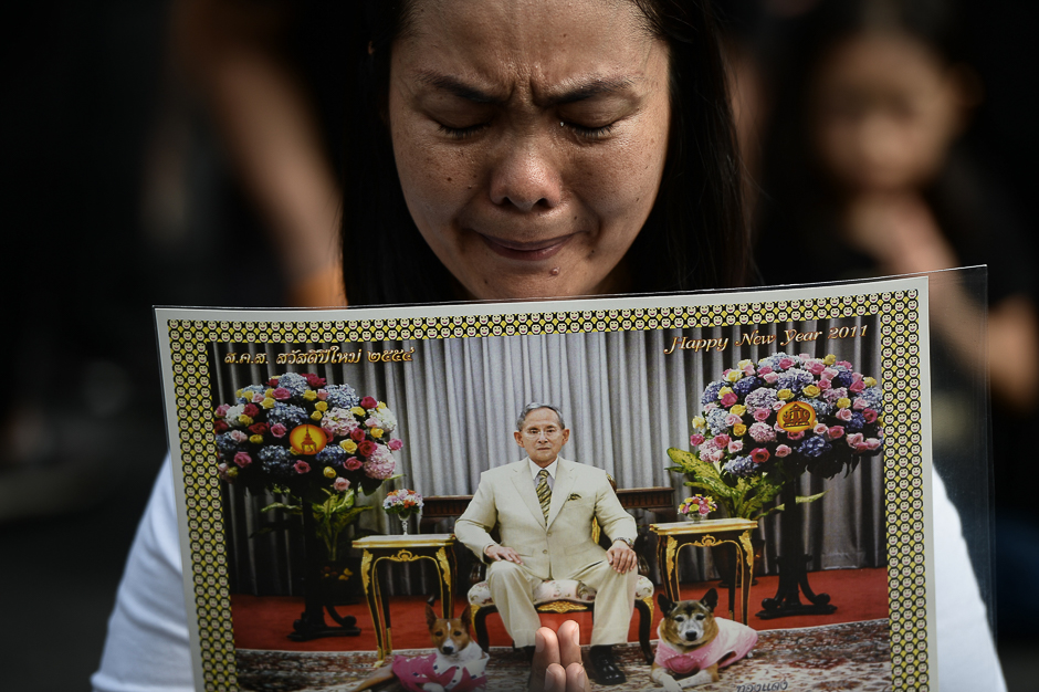 A woman cries whilst paying her respects to the late Thai King Bhumibol Adulyadej outside of the Grand Palace in Bangkok on October 15, 2016. Bhumibol, the world's longest-reigning monarch, passed away at 88, after years of ill health, ending seven decades as a stabilising figure in a nation of deep political divisions. read. PHOTO: AFP