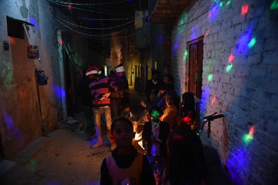 Pakistani Christians gather on a street to celebrate Christmas in Islamabad. PHOTO: AFP