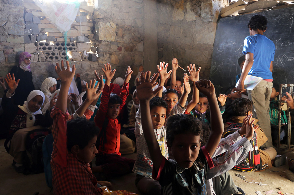 Yemeni children attend a class at a school that was damaged in a recent Saudi-led air strike in the country's third-city of Taez. PHOTO: AFP