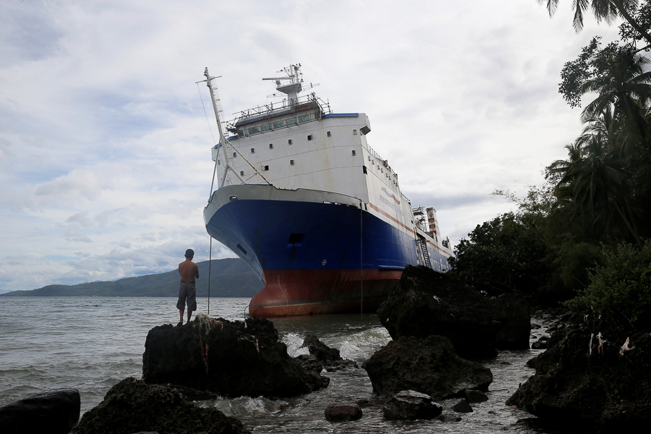 A passenger inter-island ferry Shuttle RoRo 5 is pictured after it was swept ashore at the height of Typhoon Nock-Ten in Mabini, Batangas in the Philippines. PHOTO: REUTERS