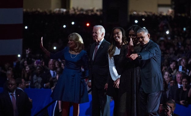 U.S. President Barack Obama along with first lady Michelle Obama, daughter Malia Obama, Vice President Joe Biden and his wife Dr. Jill Biden wave goodbye to supporters after Obama's farewell address at McCormick Place on January 10, 2017 in Chicago, Illinois. PHOTO: AFP