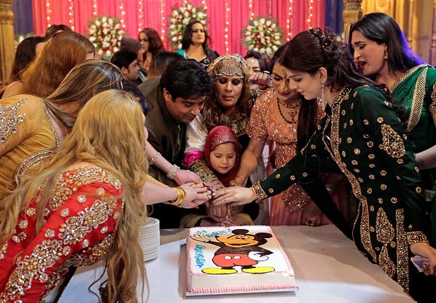 Guests cut a cake at Shakeela's party in Peshawar, Pakistan January 22, 2017. PHOTO: REUTERS