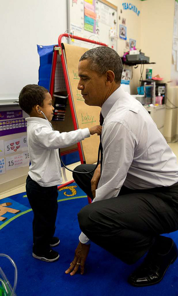The President was visiting a classroom at Powell Elementary School in Washington, DC. A young boy was using a stethoscope during the class, and as the President was about to leave the room, the President asked him to check his heartbeat. PHOTO: PETE SOUZA
