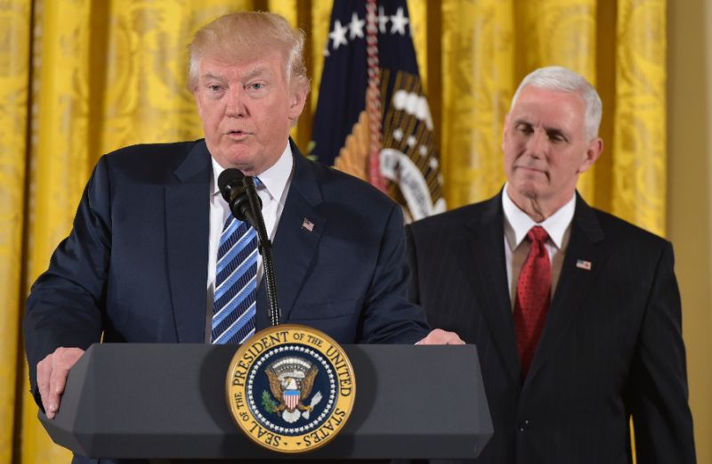 us president donald trump speaks as vice president mike pence watches photo afp