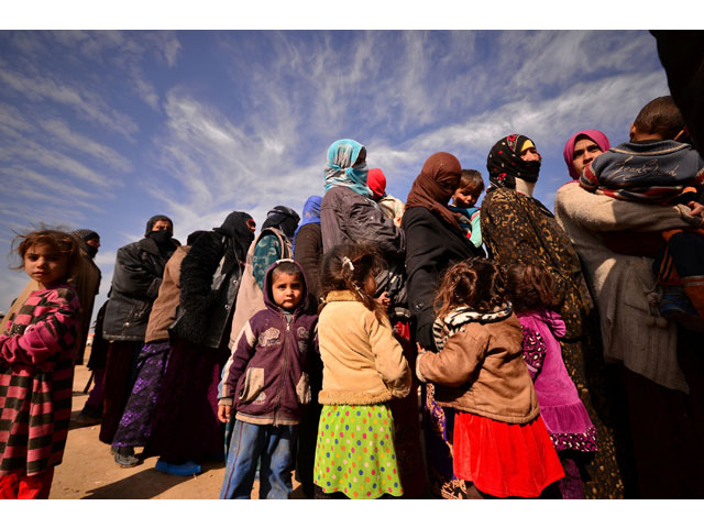 displaced women and children who fled from fighting with islamic state militants arrive at hashid shaabi or popular mobilisation forces pmf camp west of mosul iraq january 30 2017 photo reuters