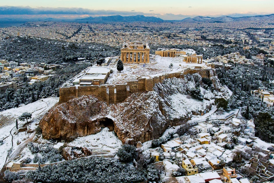The Parthenon temple atop the ancient Acropolis is seen following a rare snowfall in Athens, Greece. PHOTO: REUTERS