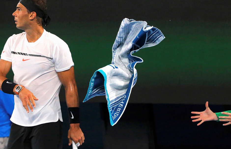 Spain's Rafael Nadal throws his towel during his Men's singles second round match against Cyprus' Marcos Baghdatis, Australian Open, Melbourne Park, Melbourne PHOTO: REUTERS
