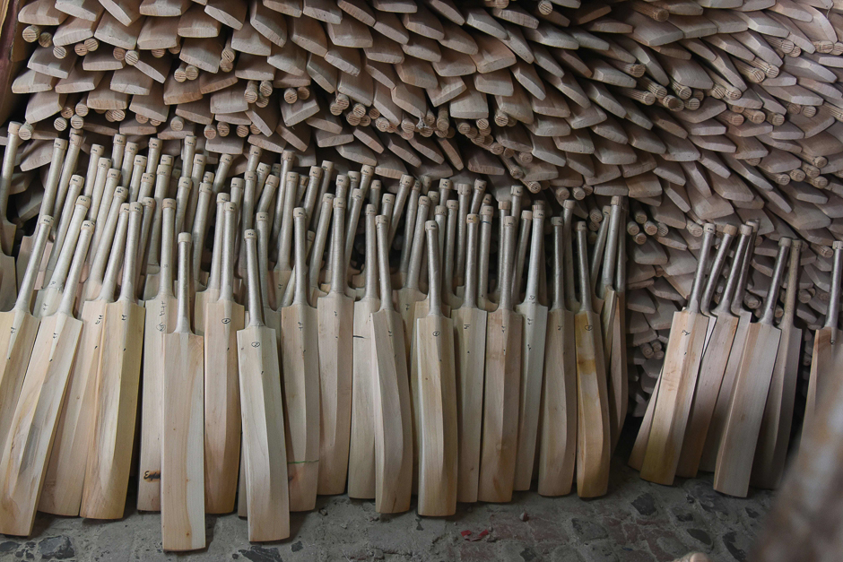 In this photograph finished cricket bats stand awaiting labeling in a factory in Meerut, some 70kms north-east of New Delhi. PHOTO: AFP