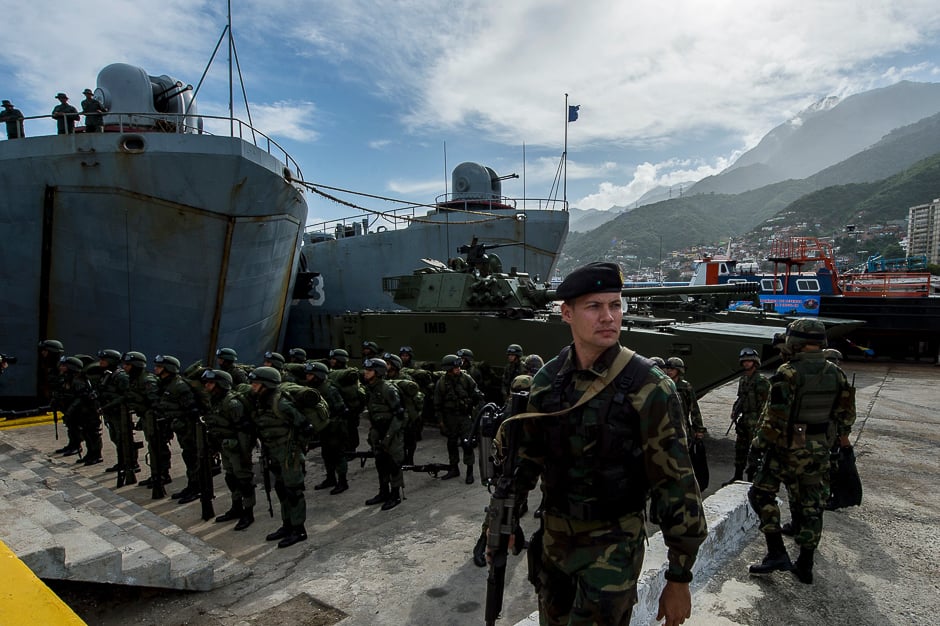 Venezuelan soldiers prepare to embark for military maneuvers at the port of La Guaira, Venezuela. PHOTO: AFP
