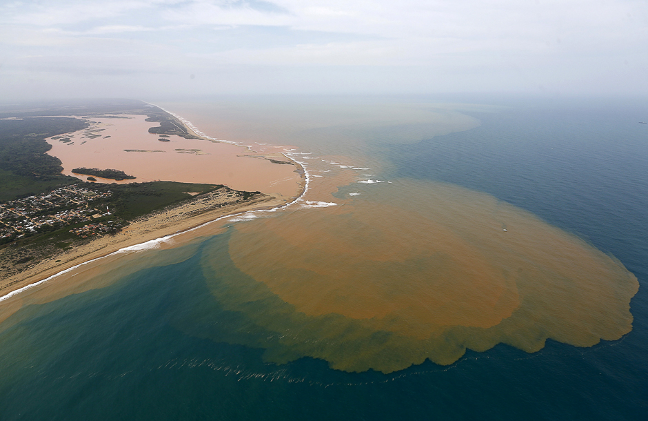 An aerial view shows the Rio Doce (Doce River), which was flooded with mud after a dam owned by Vale SA and BHP Billiton Ltd burst, at an area where the river joins the sea on the coast of Espirito Santo in Regencia Village, Brazil. PHOTO: REUTERS