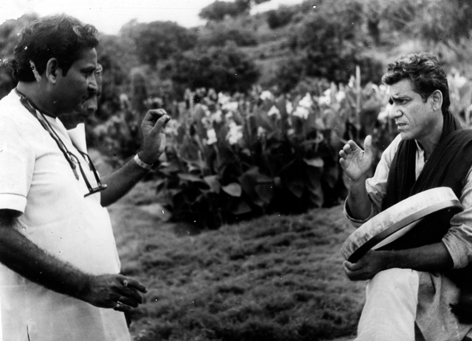 Director Dinkar Chowdhury briefing Om Puri on the set of film AKANKSHA. Express archive photo
