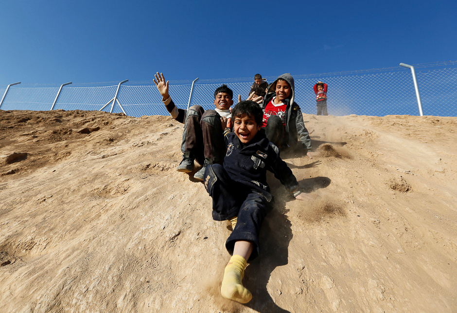 Displaced Iraqi boys who fled the Islamic State stronghold of Mosul play at Khazer camp, Iraq. PHOTO: REUTERS