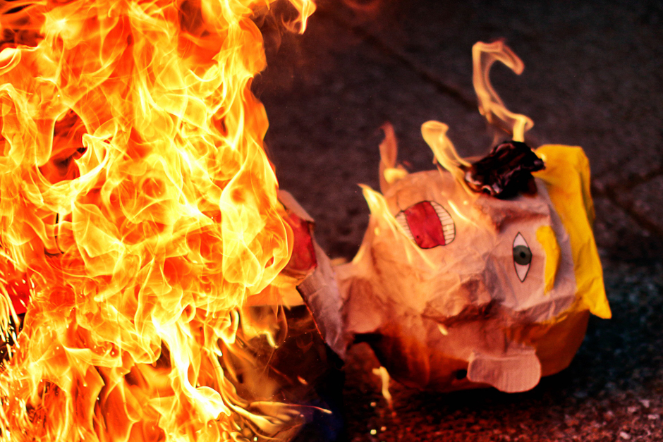 An effigy representing US President Donald Trump is burnt during a protest against his inauguration in Mexico City. PHOTO: AFP