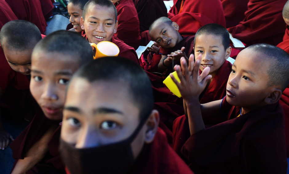 Young Buddhist monks participate in a special religious teaching prayer attended by the Tibetan spiritual leader, The Dalai Lama during the Kalachakra event at Bodhgaya. PHOTO: AFP