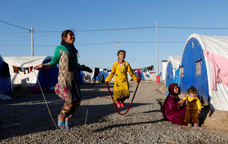 Displaced Iraqi girls who fled the Islamic State stronghold of Mosul, play at Khazer camp, Iraq. PHOTO: REUTERS